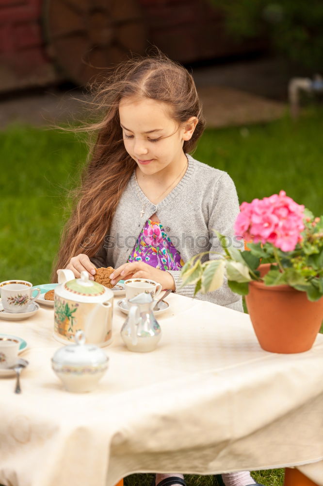 Similar – child girl having breakfast at home