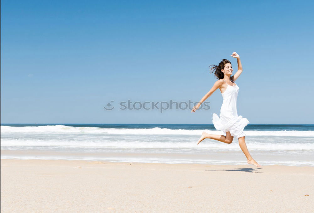 Similar – Happy teen girl jumping on the beach