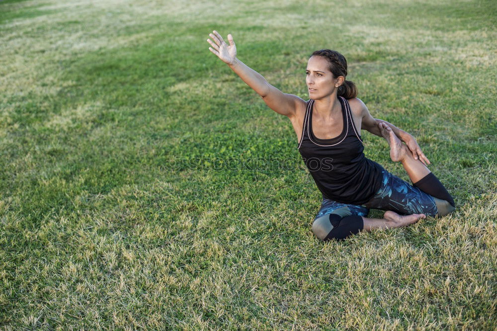 Similar – Winter ideas. Beautiful young girl stretching her finger upwards while snowing on a green meadow.