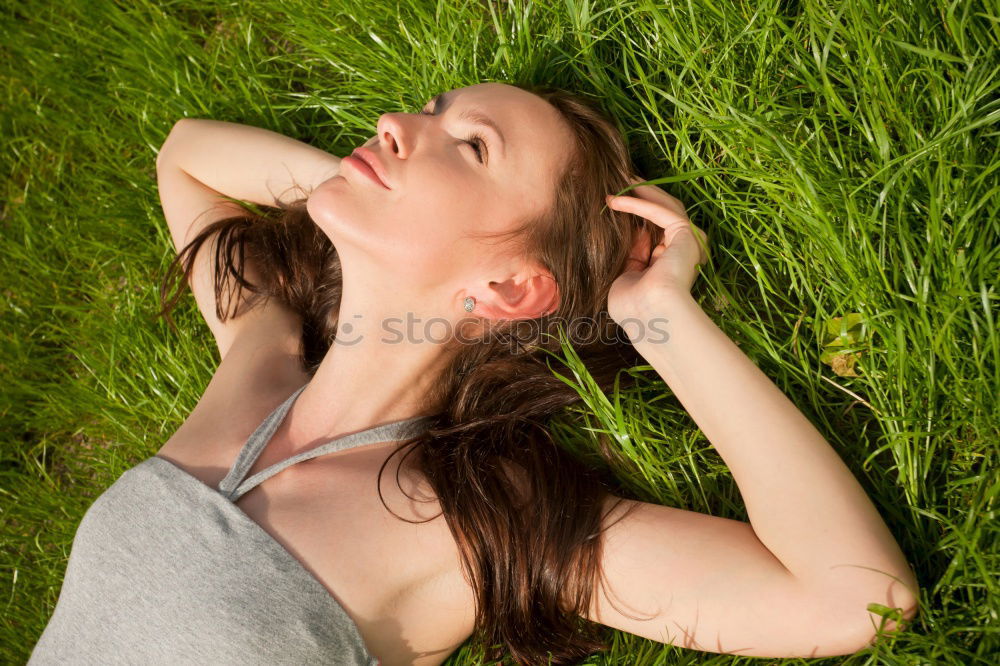 Similar – Excited girl in headphones on grass