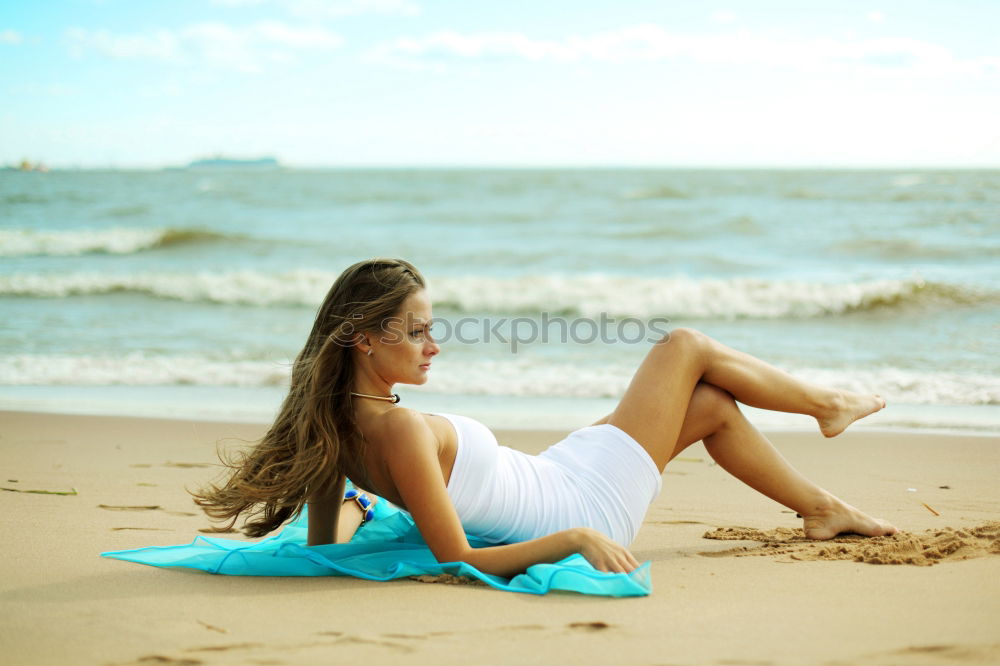 Similar – Süßes fröhliches kleines Mädchen, das im Badeanzug am Strand mit Sand spielt, ein Herz zeichnet und schreibt. Wunderschöner Sommersonnenuntergang, Meer, Kokospalmen, malerische exotische Landschaft. Phuket, Thailand