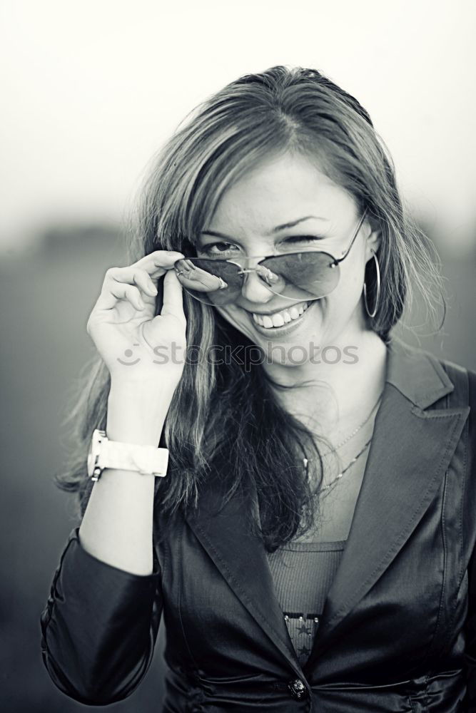 Similar – Woman in red coat with mobile phone in hands, smartphone, urban scene