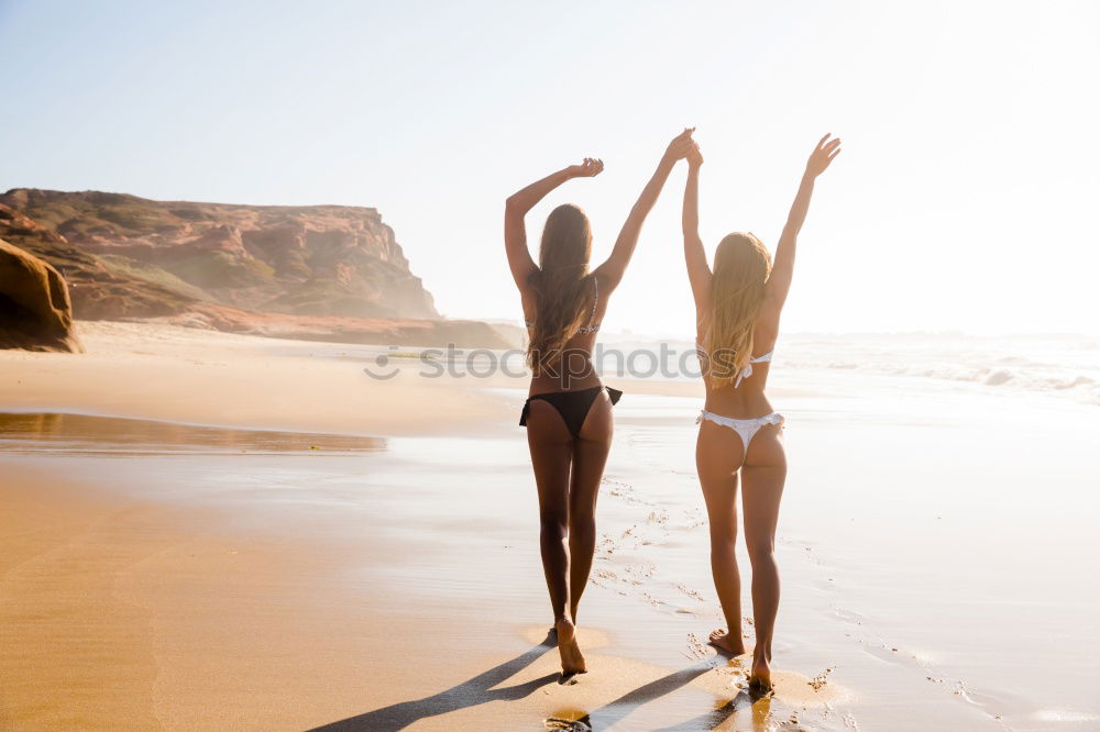 Similar – Image, Stock Photo Two young women in bikini having fun on a tropical beach