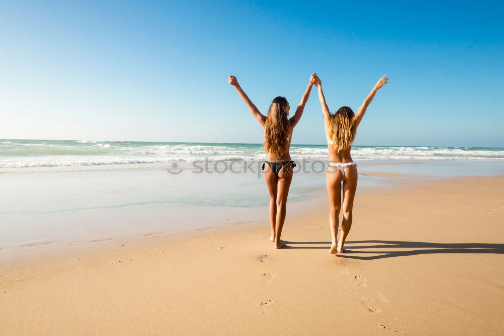 Image, Stock Photo Two young women in bikini having fun on a tropical beach