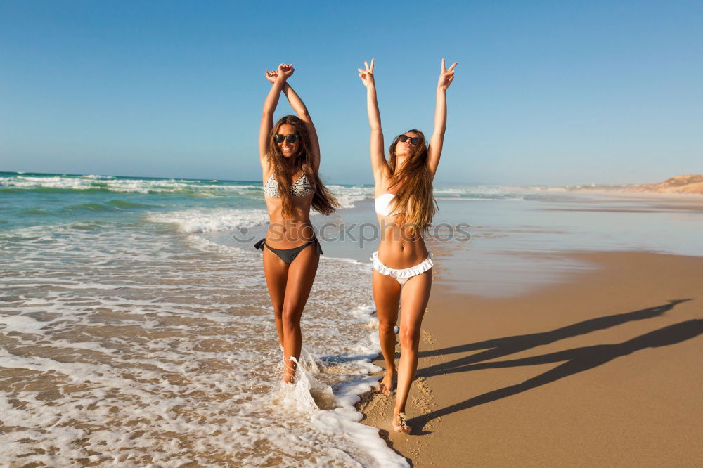 Similar – Image, Stock Photo Two women with beautiful bodies in swimwear on the beach