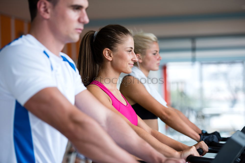 Similar – Concentrated woman in hard bike training session