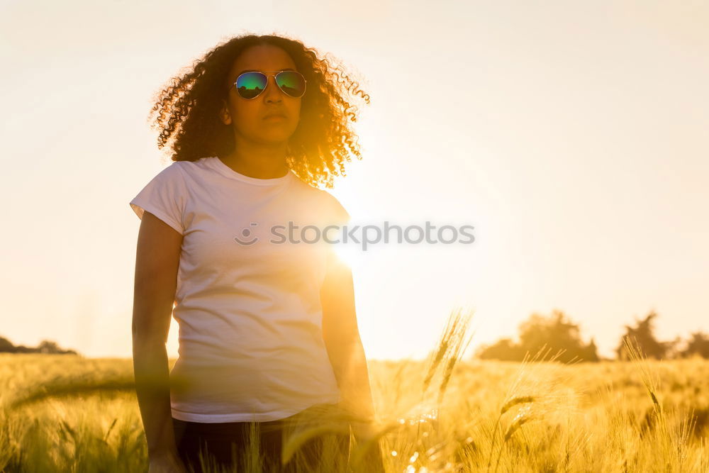 Similar – Image, Stock Photo Young woman with yellow dress and hat walks in the countryside.