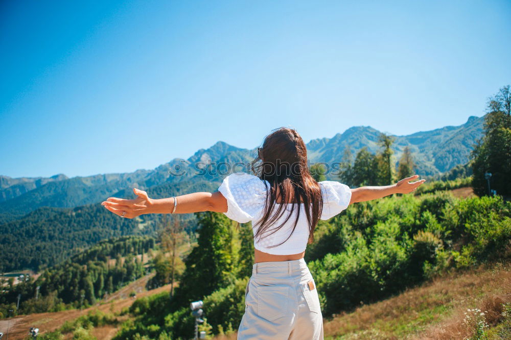 Similar – Stylish woman on picturesque landscape