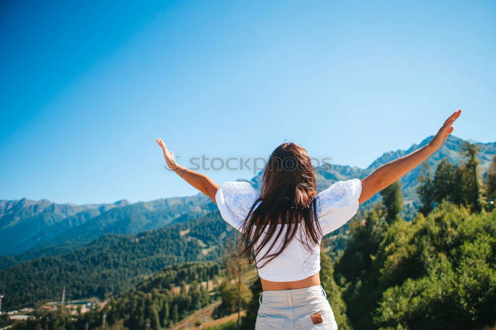 Similar – Stylish woman on picturesque landscape