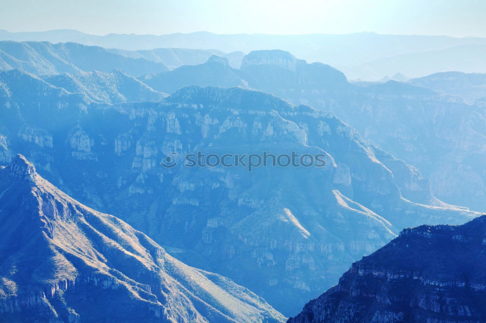 Similar – Tourist standing in mountains