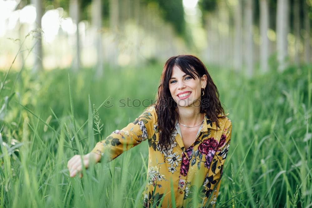 Similar – Image, Stock Photo Portrait of tall beautiful woman with long dark curly hair in forest