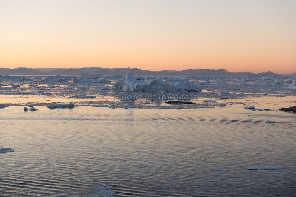 Similar – Image, Stock Photo Aerial sunset surface of Neco bay surrounded by glaciers