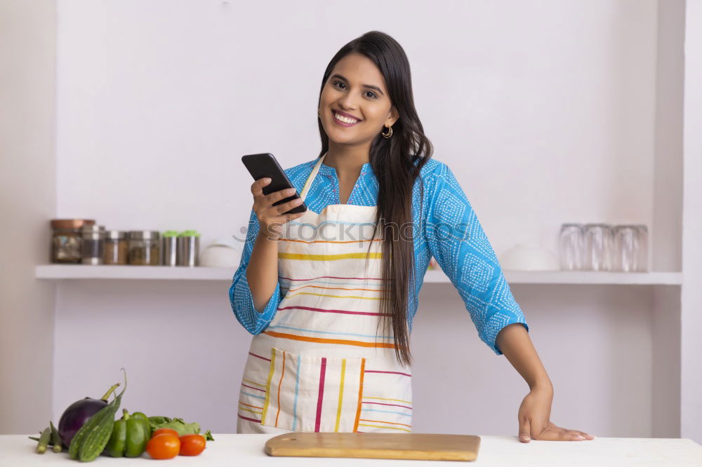 Similar – Image, Stock Photo Happy contented housewife in her kitchen