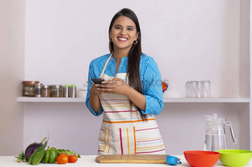 Image, Stock Photo Happy contented housewife in her kitchen