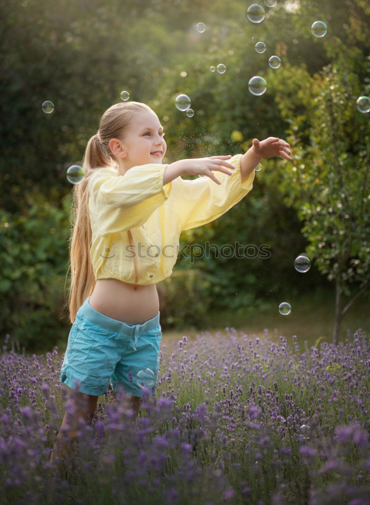 Similar – Image, Stock Photo Young girl with brown hair is playing outside.