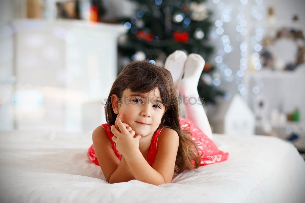 Similar – cute happy child girl relaxing at home on the bed