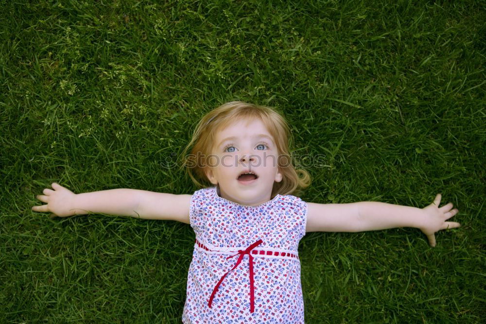 Similar – girl child tongue meadow