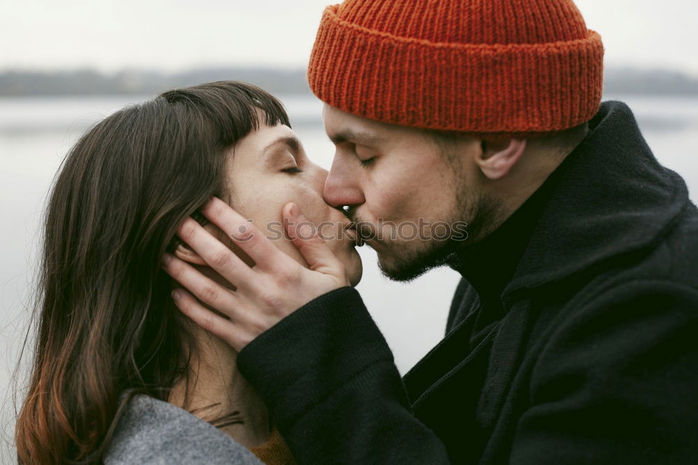 Similar – Woman with gift box in hand embracing and kissing to boyfriend