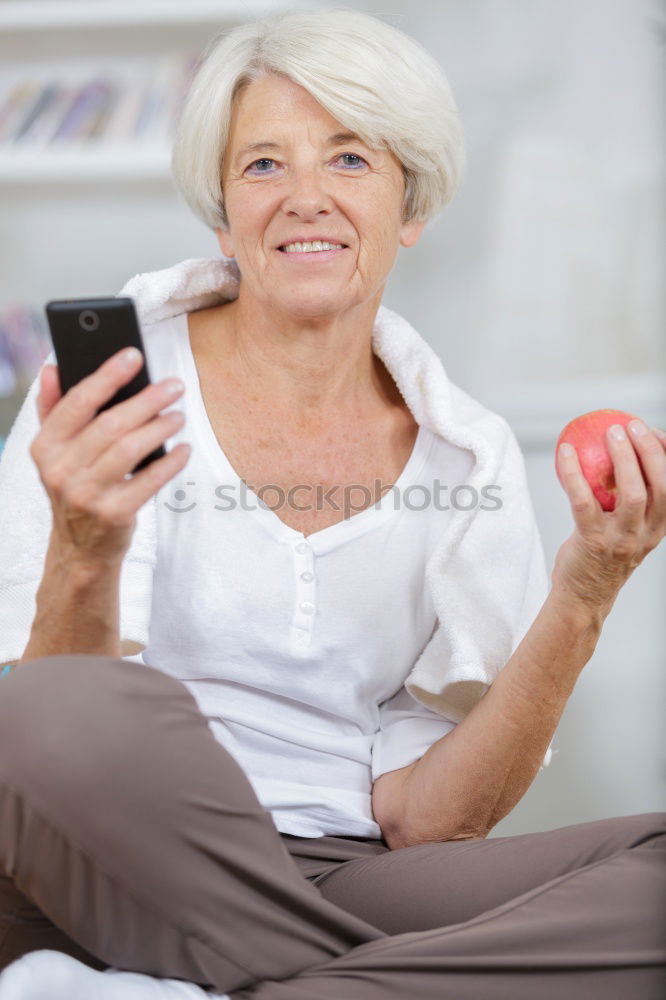 Similar – senior woman using smartphone