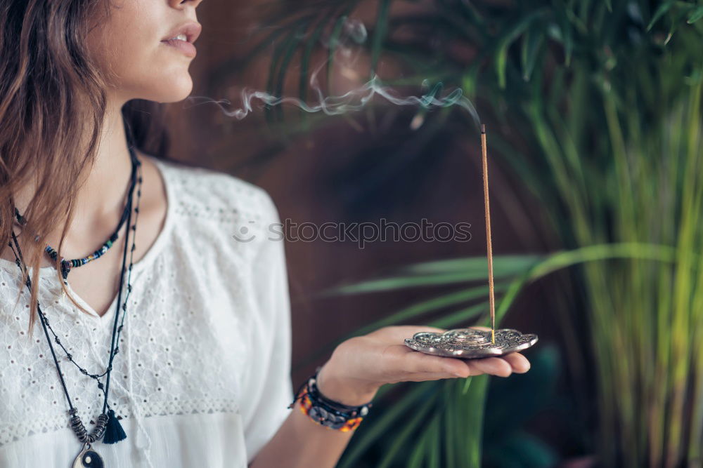 Similar – Young girl sitting on the floor and smoke