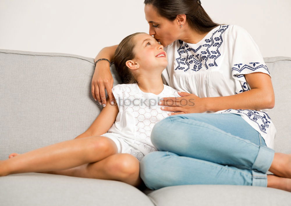 happy toddler girl playing with mother at home