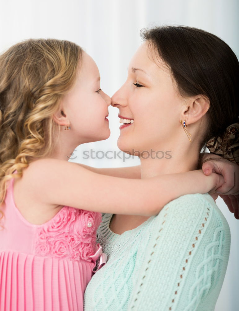 Image, Stock Photo Beautiful mother and daughter touching each other with their noses. Lovely family portrait