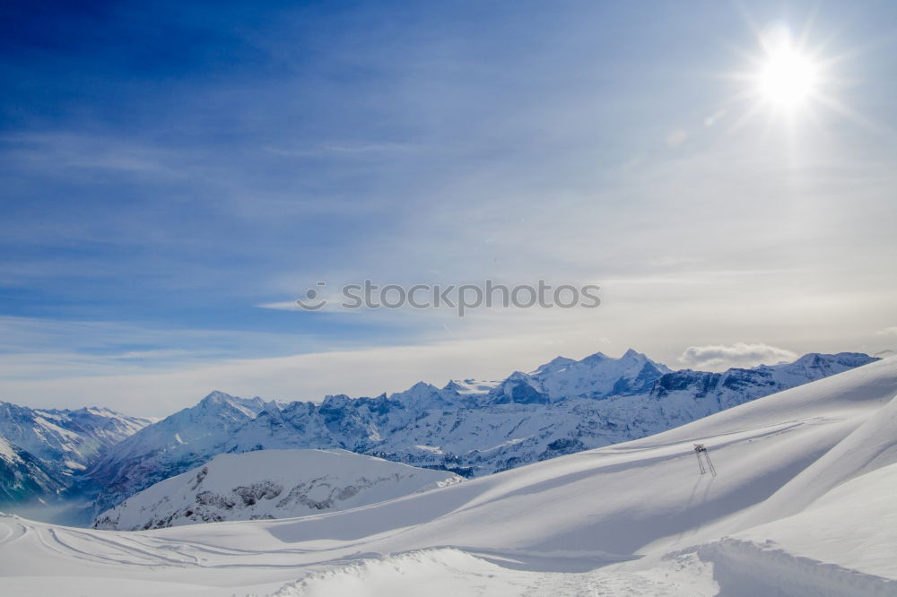 Similar – Image, Stock Photo Snowy blue mountains in clouds at sunset