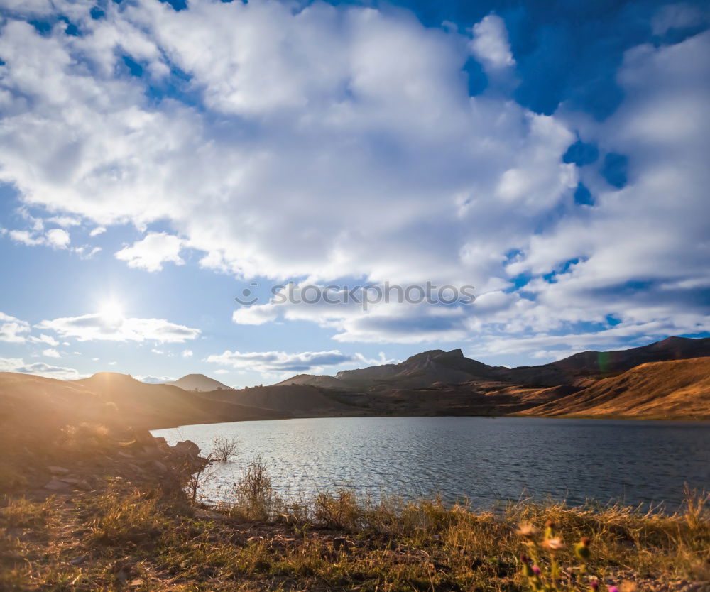 Similar – Lake in sunny mountains