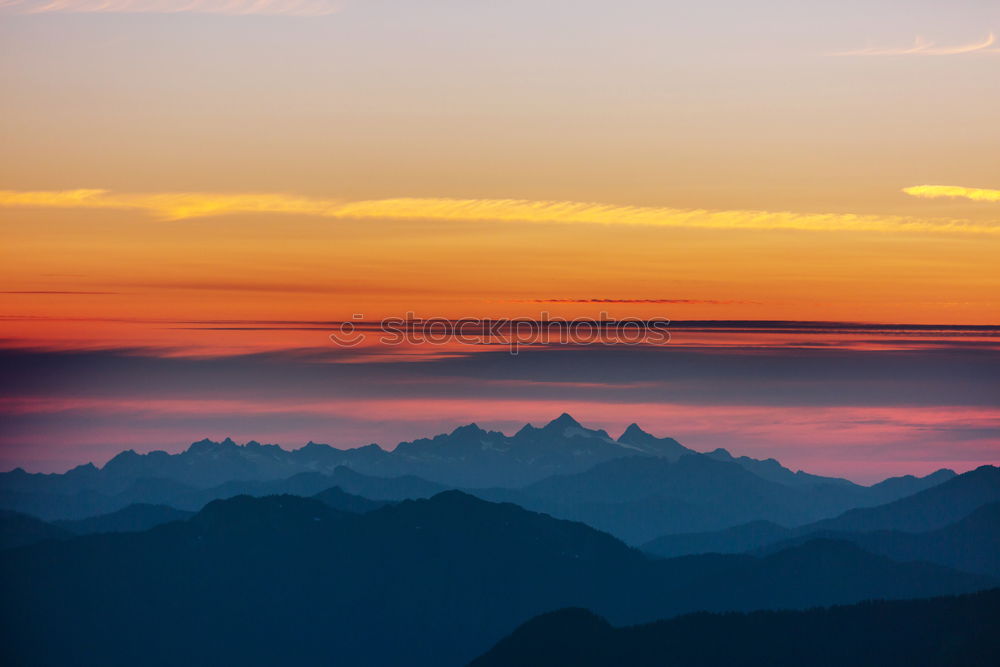 Similar – Mountain silhouette in sunset