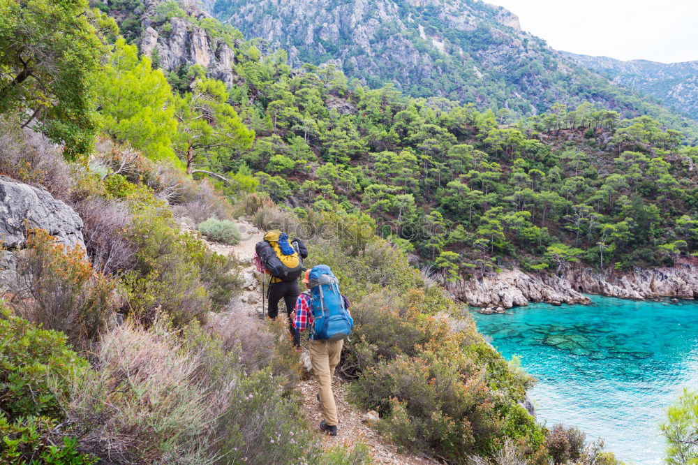 Similar – Women at lake in mountains