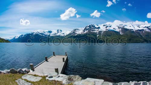 Similar – Image, Stock Photo Mountain landscape with a lot of kite surfers and windsurfers moving in a lake. They use the wind to move their boards on the water. Mountains are as background in a sunny day.