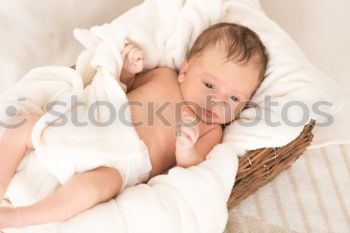 Similar – Person touching hand of baby