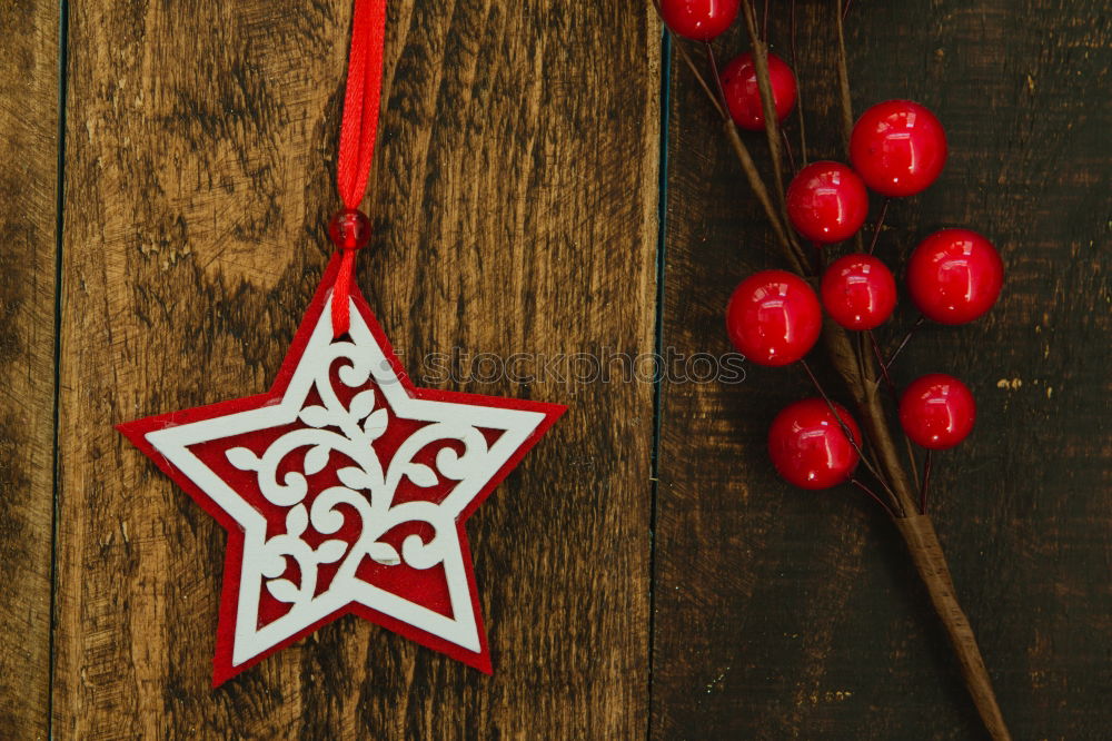 Similar – Red Christmas star with branch of berries