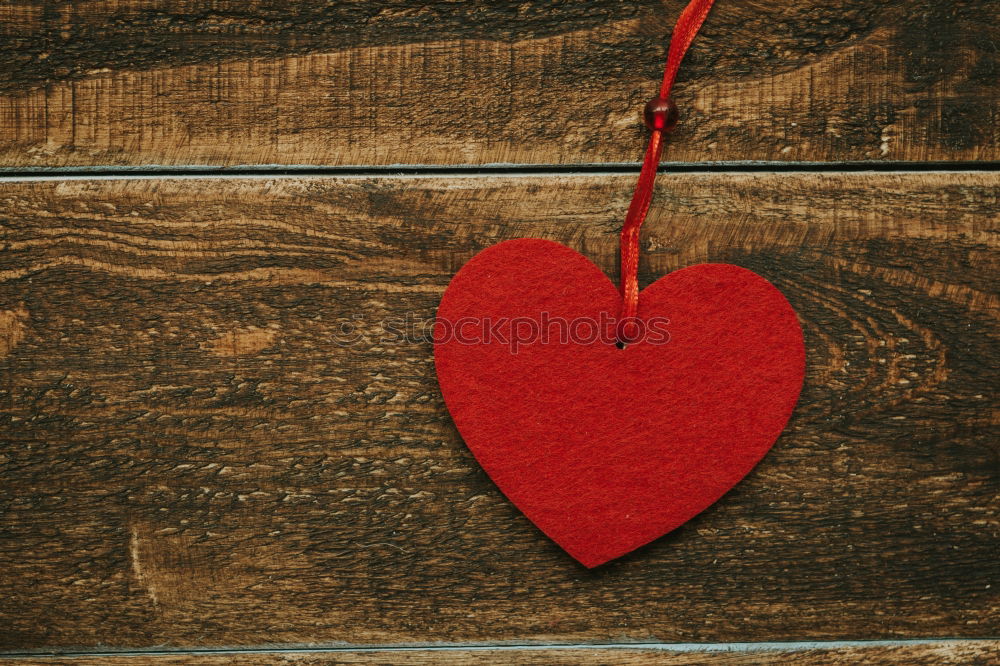 Similar – A red heart and LOVE are painted in gradient bright red color on a black wall / love