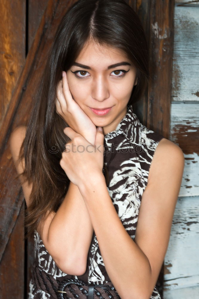 Similar – Girl with blue eyes smiling sitting on urban step