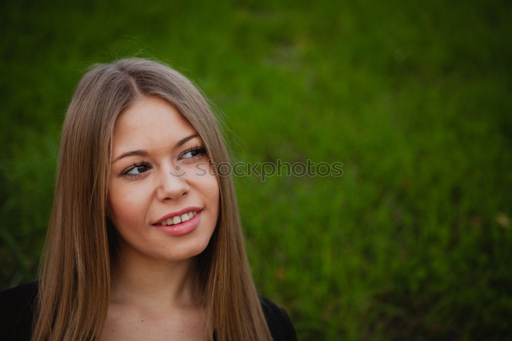 Similar – young woman in front of a wall with a climbing plant