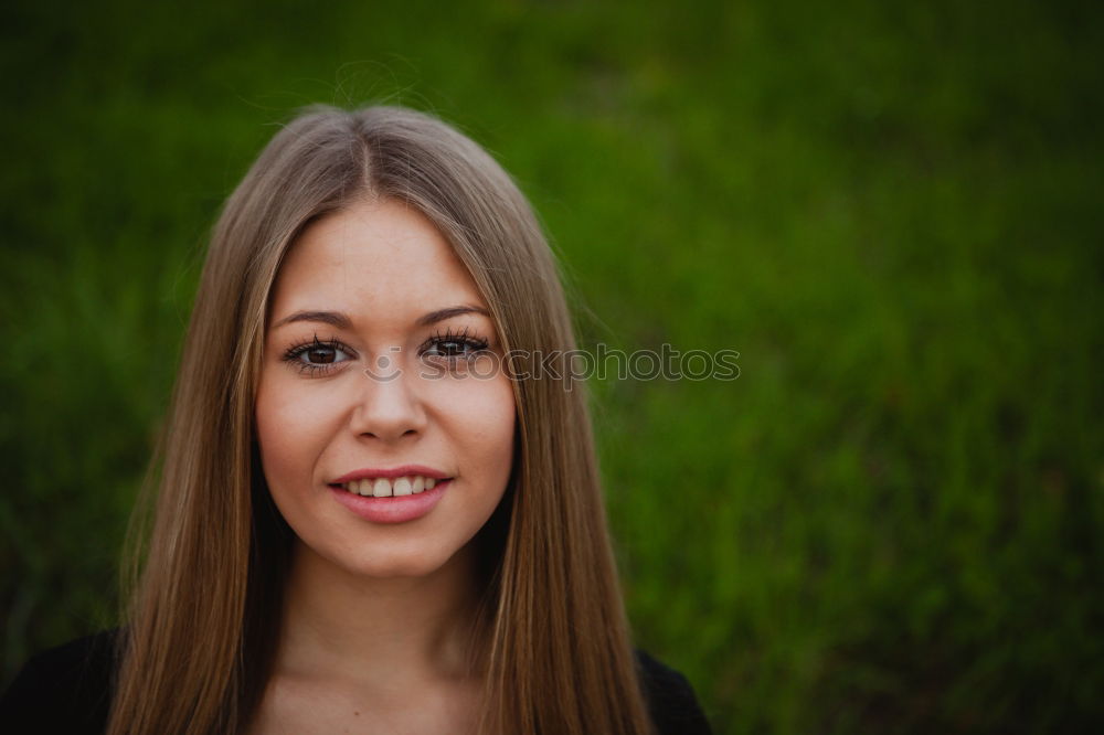 Similar – young woman in front of a wall with a climbing plant