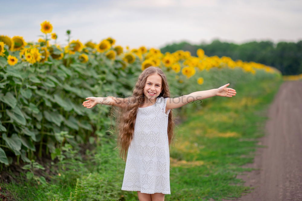 Similar – Image, Stock Photo Little girl in nature field wearing beautiful dress