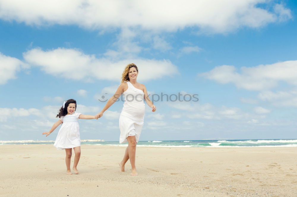 Similar – Happy family walking on the beach at the day time.