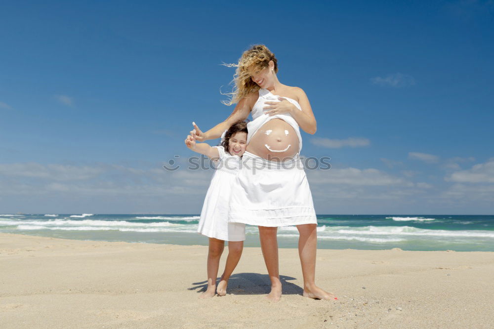 Similar – Image, Stock Photo Mother and son pointing a place near the sea