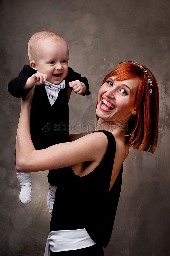 Similar – Image, Stock Photo Mother with son and confetti