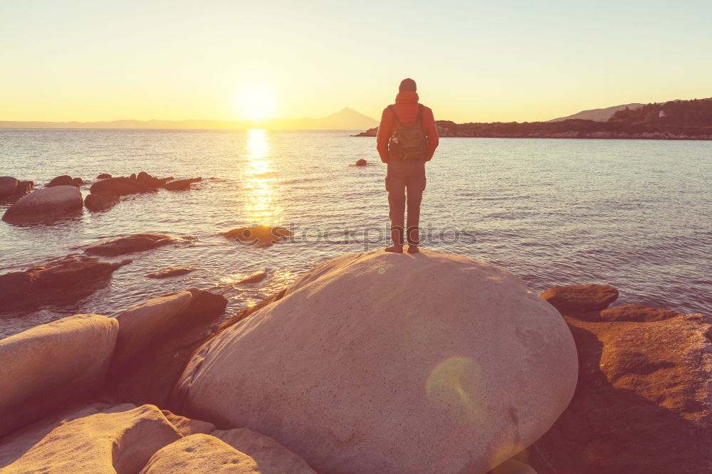 Similar – Image, Stock Photo Legs of man sitting at cliff