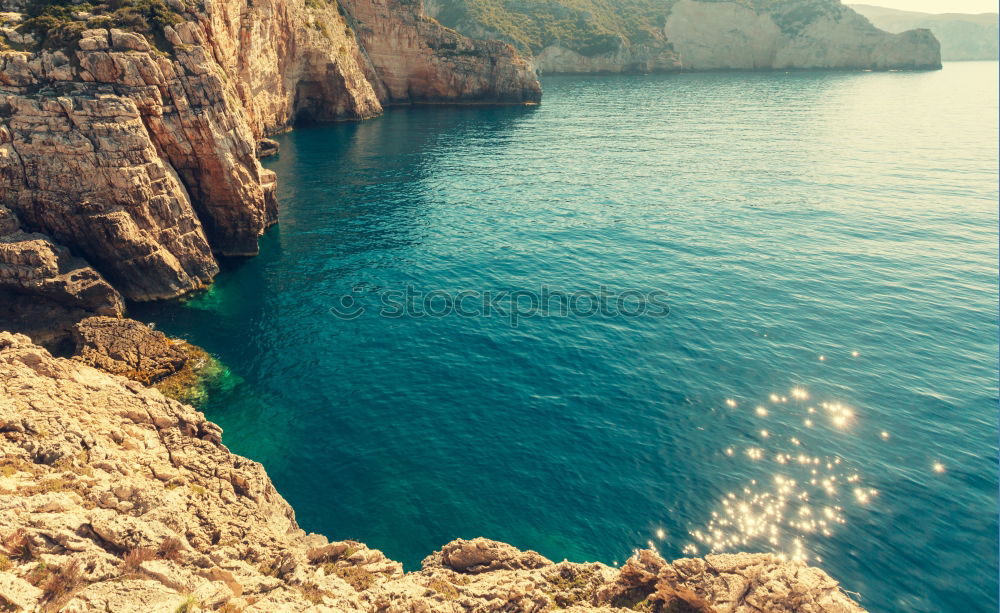 Similar – Urlaub und Erholung. Meer und Felsen. Blick vom Wasser. Idylle