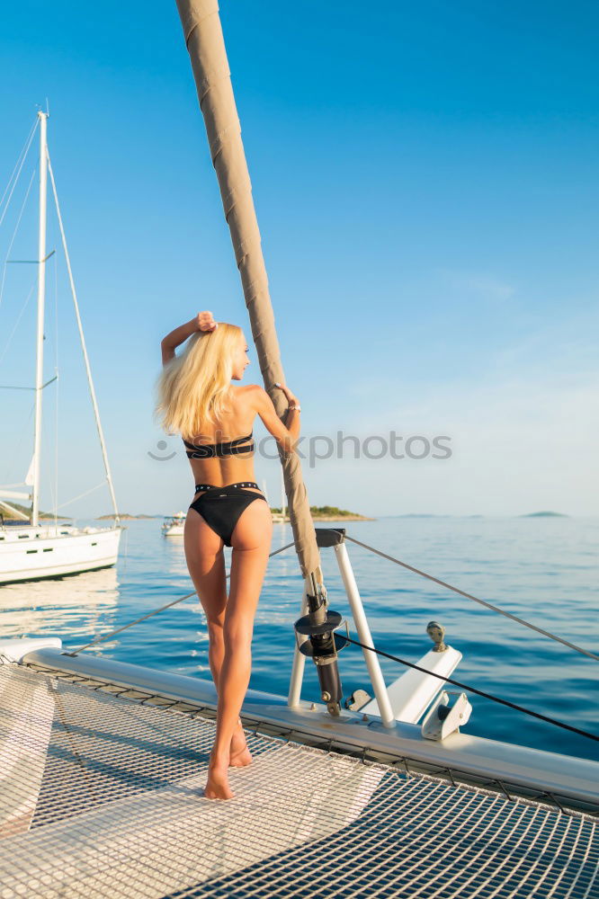 Similar – Athletic man balancing on gymnastic rings