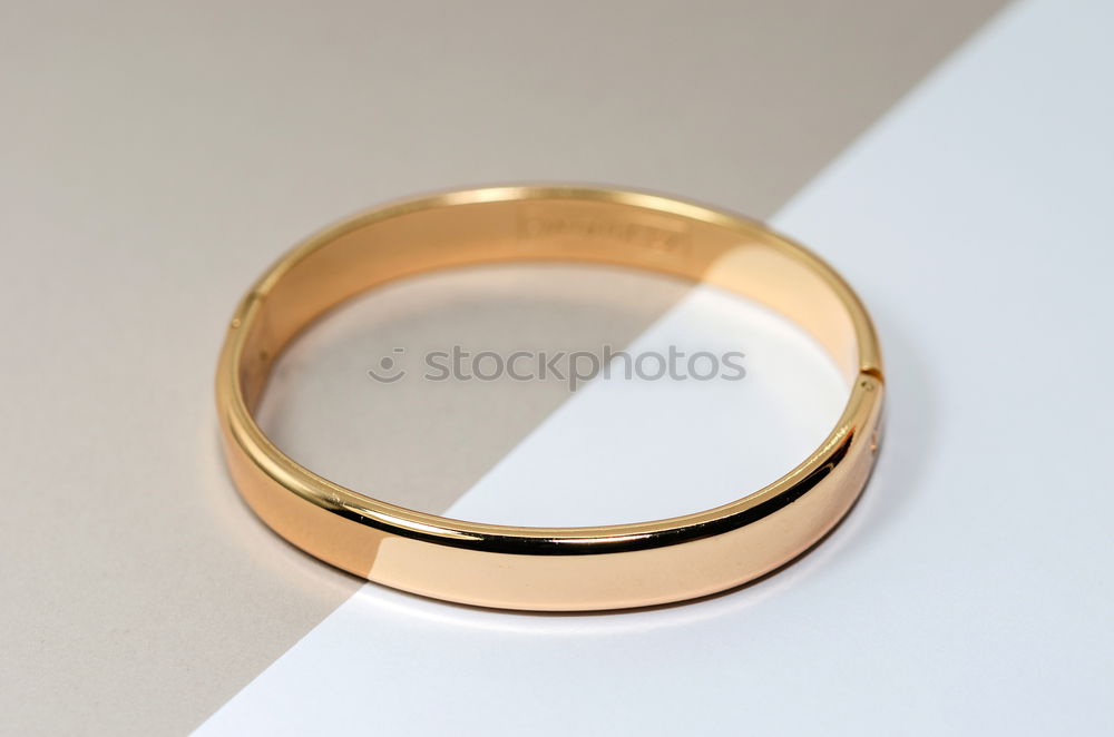 Similar – Ring with heart as shadow lies on paper