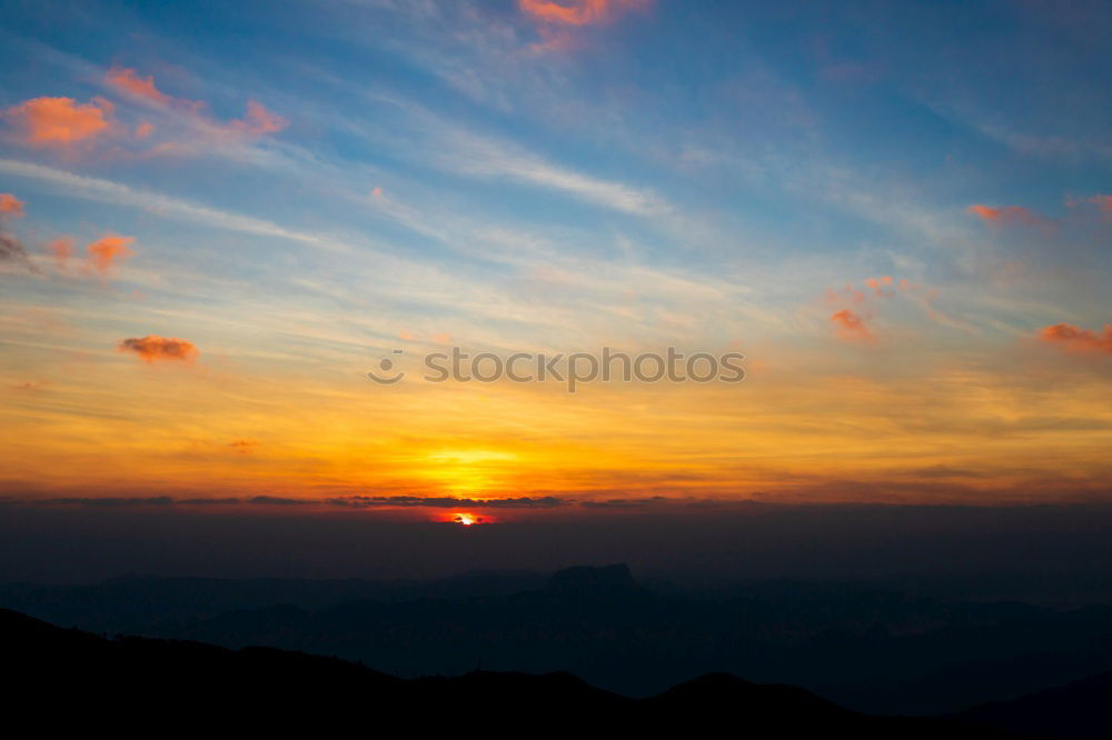 Similar – Mountain silhouette in sunset