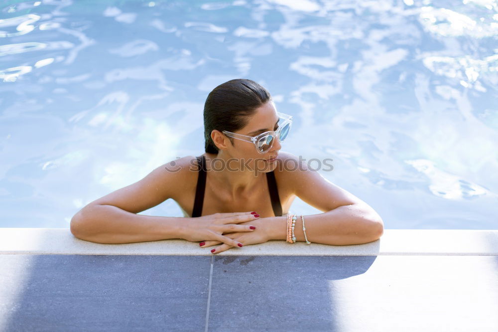 Similar – Beautiful Arab woman relaxing in swimming pool.