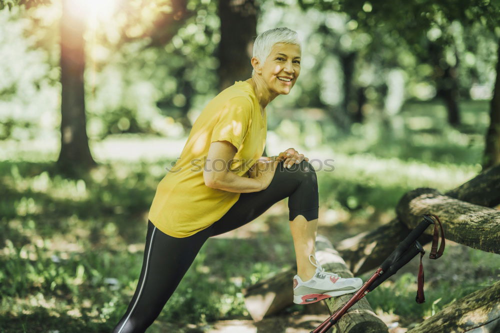 Similar – Happy senior couple on a hike trough green fields