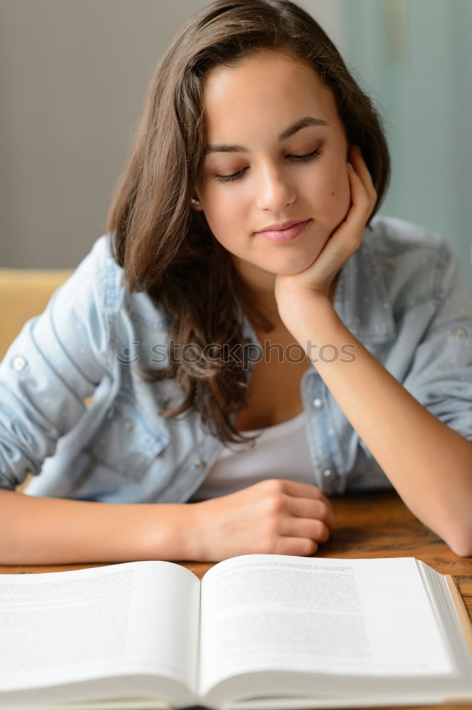 Similar – Image, Stock Photo Cute little girl lying on the carpet reading a book