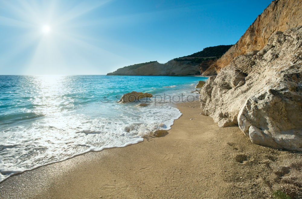 Similar – Man in wetsuit swimming in ocean